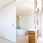 Integrated sliding doors at one with the minimalist interior